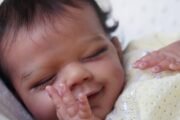 ​Full body silicone doll April dark skin tone close up