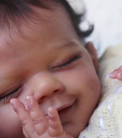 ​Full body silicone doll April dark skin tone close up