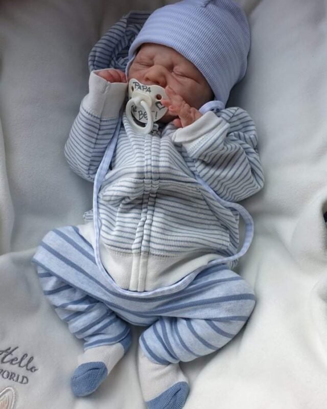 ​Full body silicone doll Chris sleeping in blue outfit
