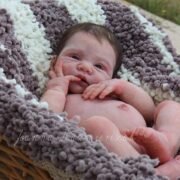 ​Full body silicone doll June sleeping in basket