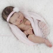 Baby Rosalee realistic reborn baby doll with dark rooted hair and closed eyes sleeping peacefully
