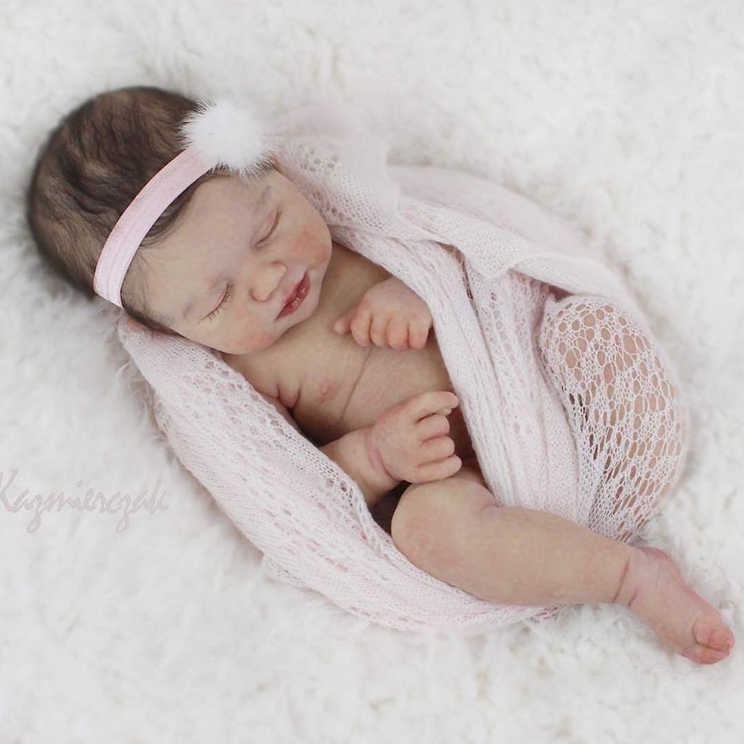 joanna_kazmierczak_-20220604-0078 Baby Rosalee realistic reborn baby doll with dark rooted hair and closed eyes sleeping peacefully