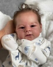 Full body silicone doll Elijah sleeping in blue outfit